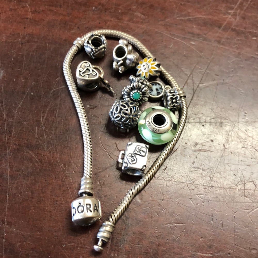 Sterling silver Pandora bracelet with nine charms